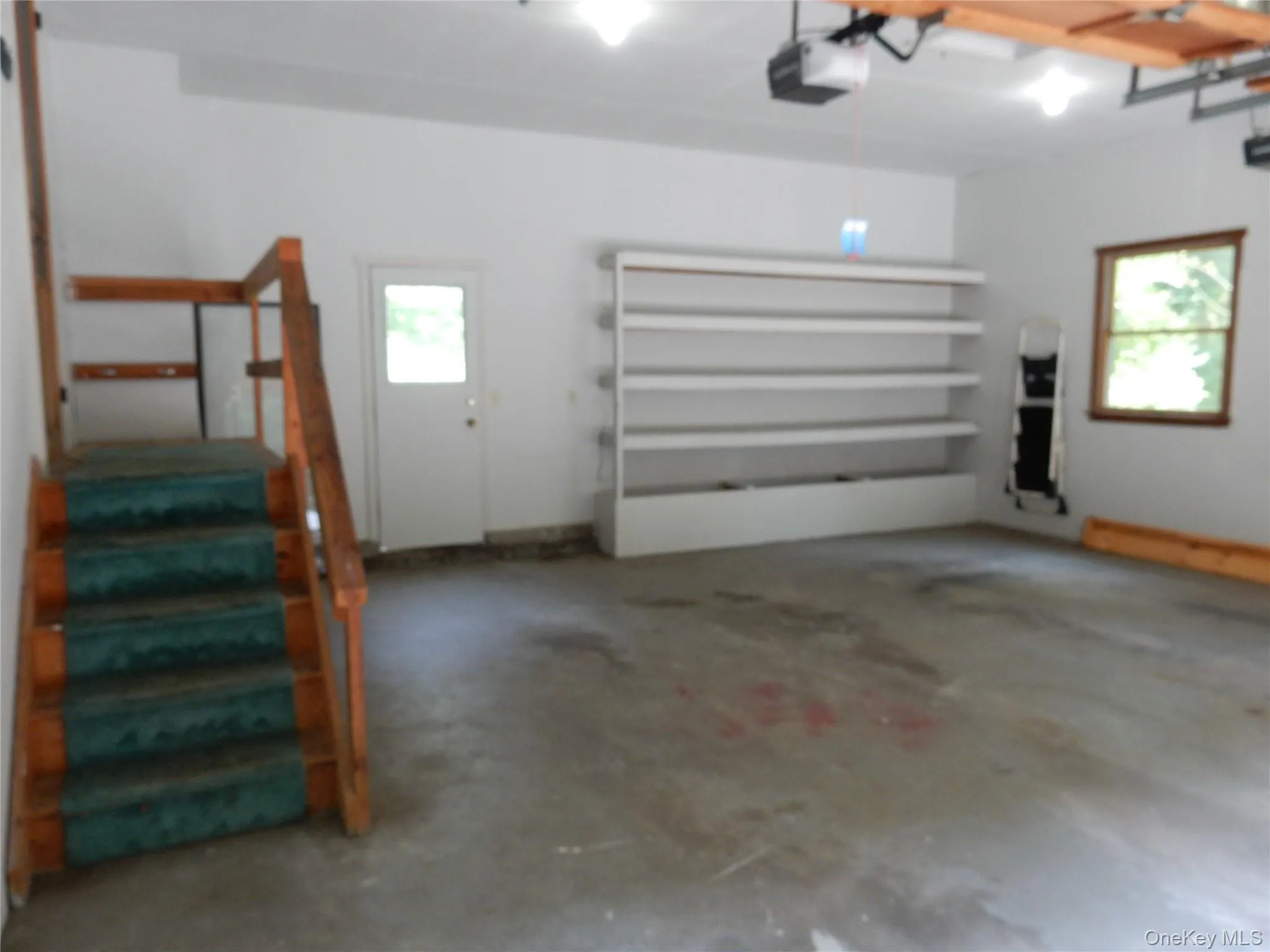 Garage featuring a garage door opener Garage featuring a garage door opener