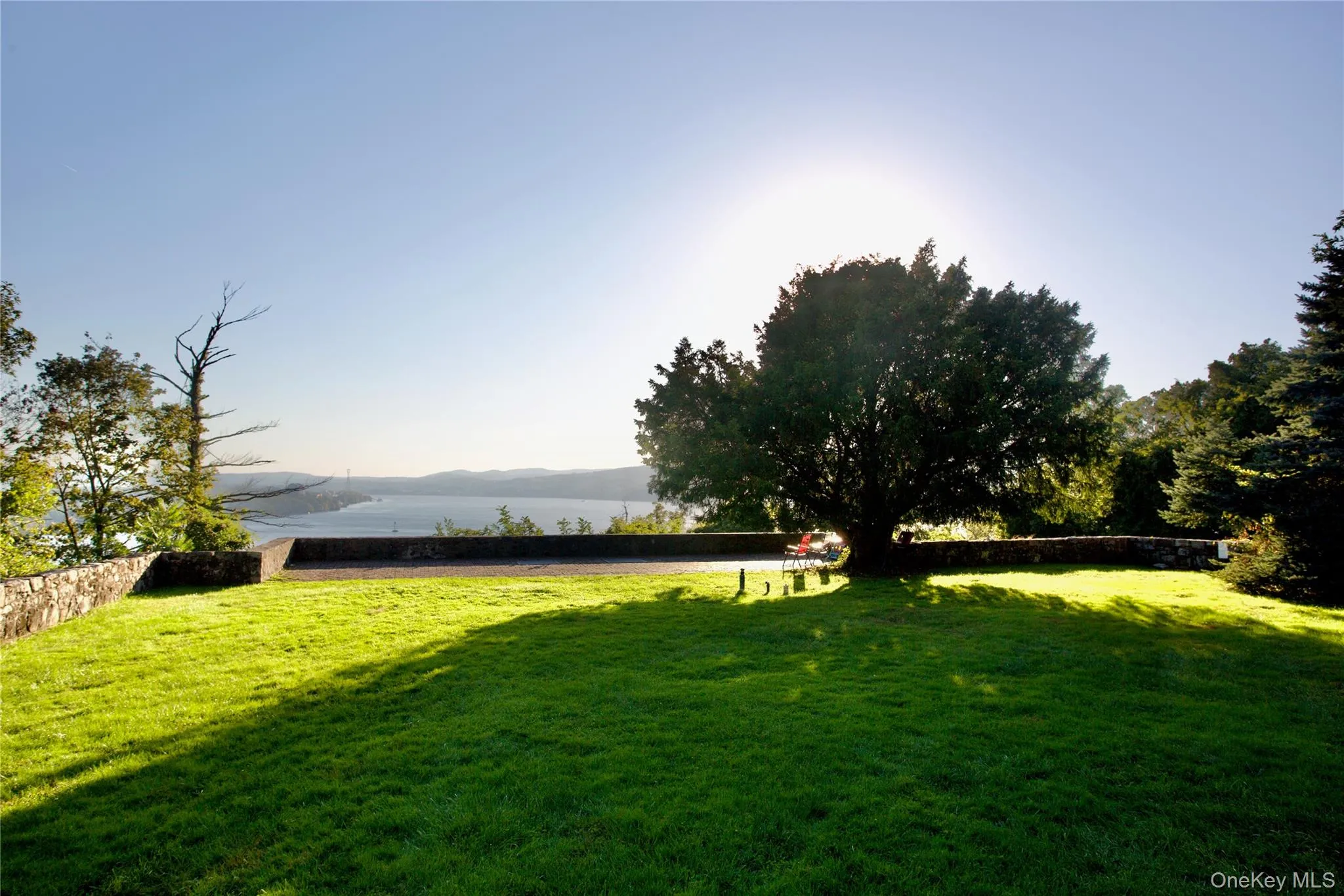 View of green lawn featuring a mountain view View of green lawn featuring a mountain view