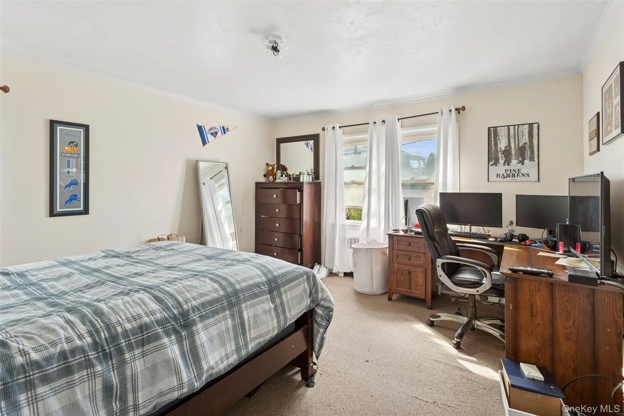 Bedroom featuring light colored carpet, crown molding, and a desk Bedroom featuring light colored carpet, crown molding, and a desk