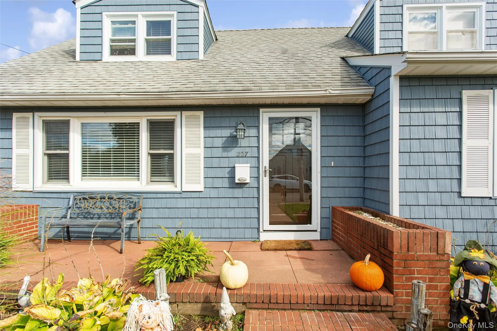 Property entrance featuring roof with shingles Property entrance featuring roof with shingles