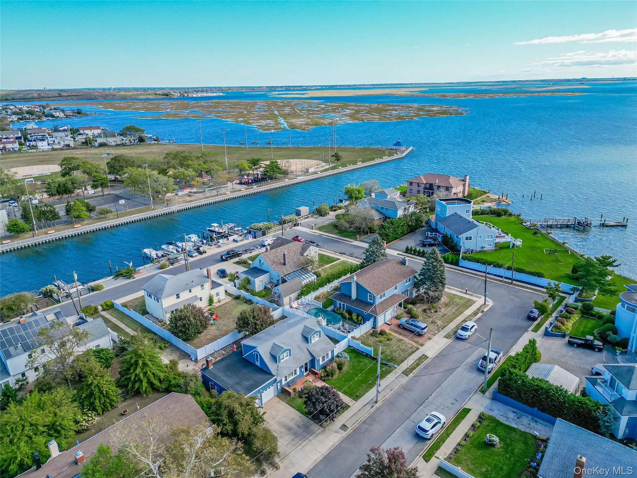 Aerial perspective of suburban area with a large body of water Aerial perspective of suburban area with a large body of water