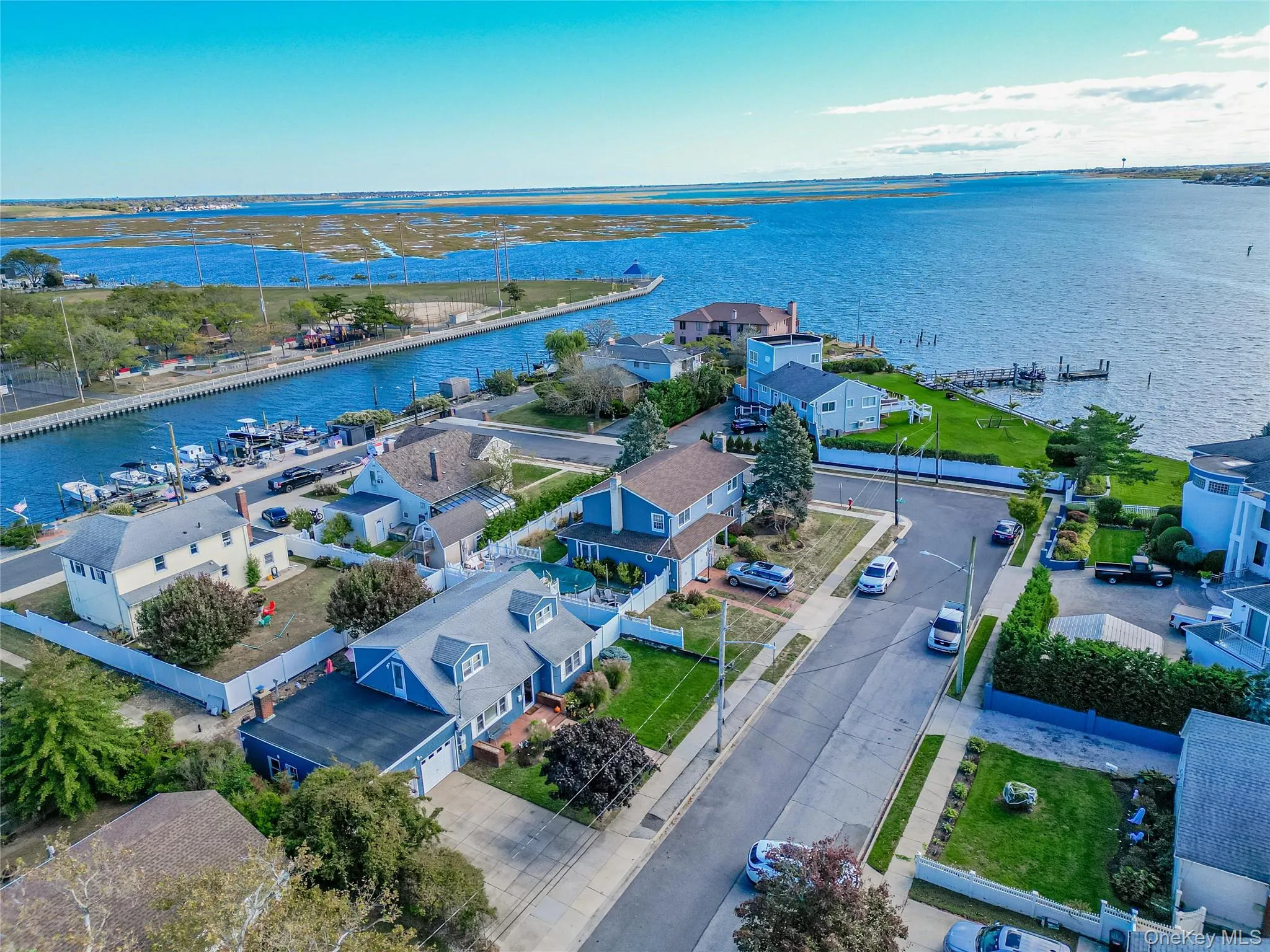 Aerial view of residential area with a large body of water Aerial view of residential area with a large body of water