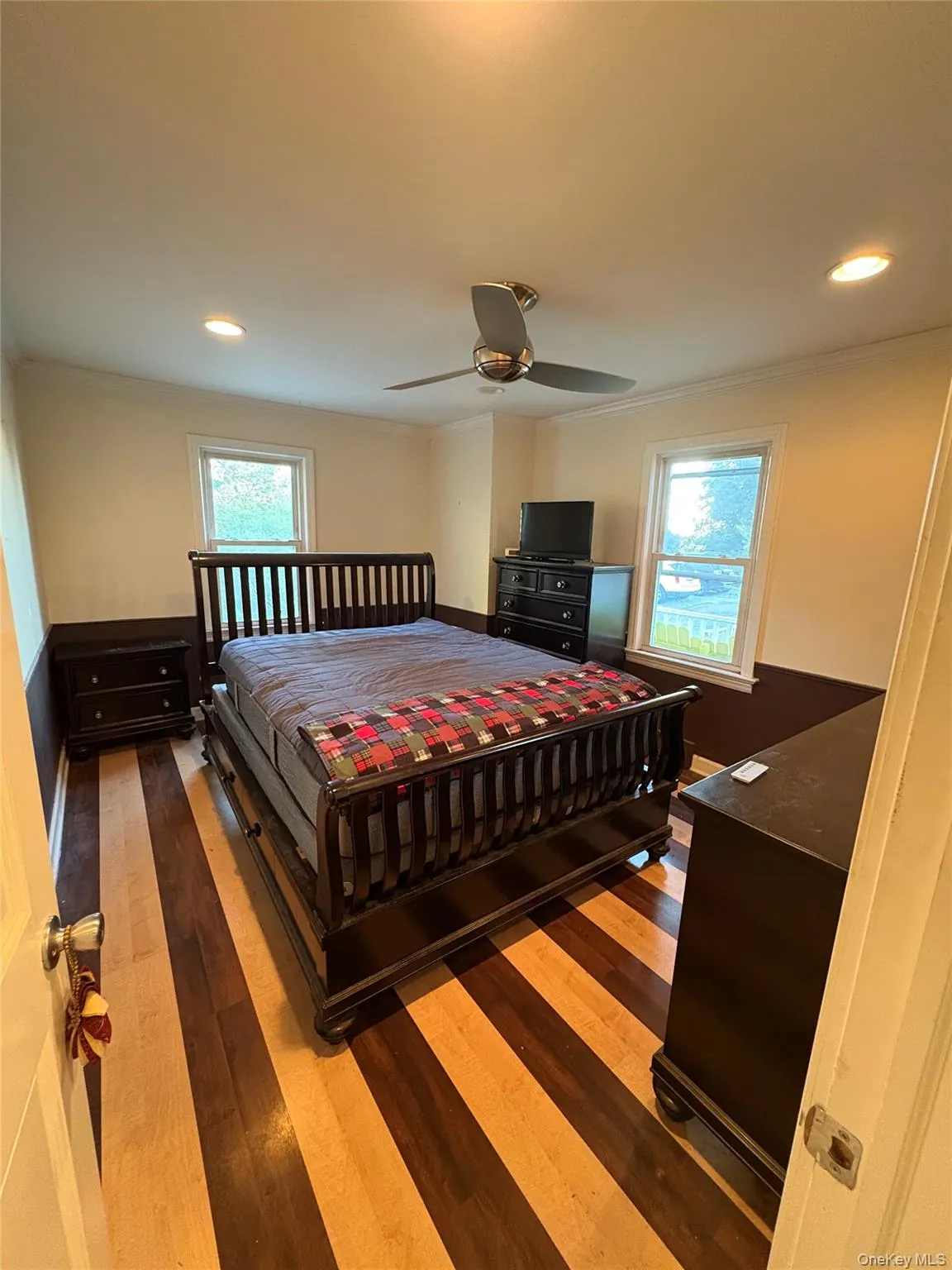 Bedroom featuring wood floors Bedroom featuring wood floors