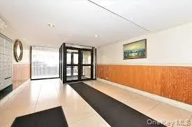 Community lobby with wainscoting and wooden walls Community lobby with wainscoting and wooden walls