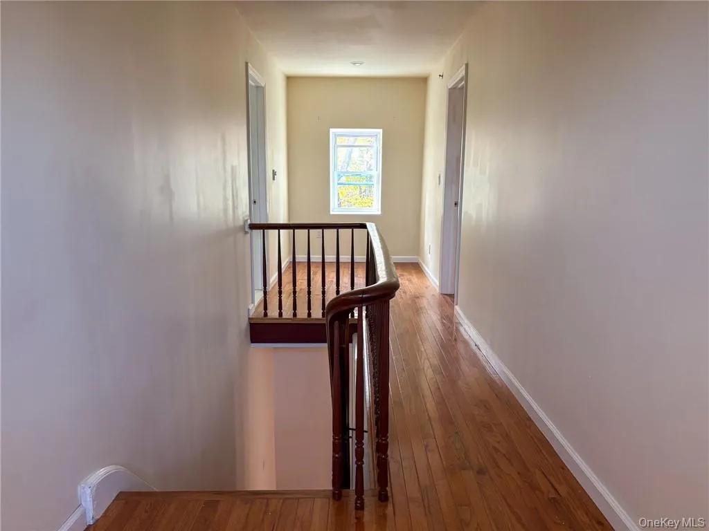Staircase leads to spacious hallway. Staircase leads to spacious hallway.