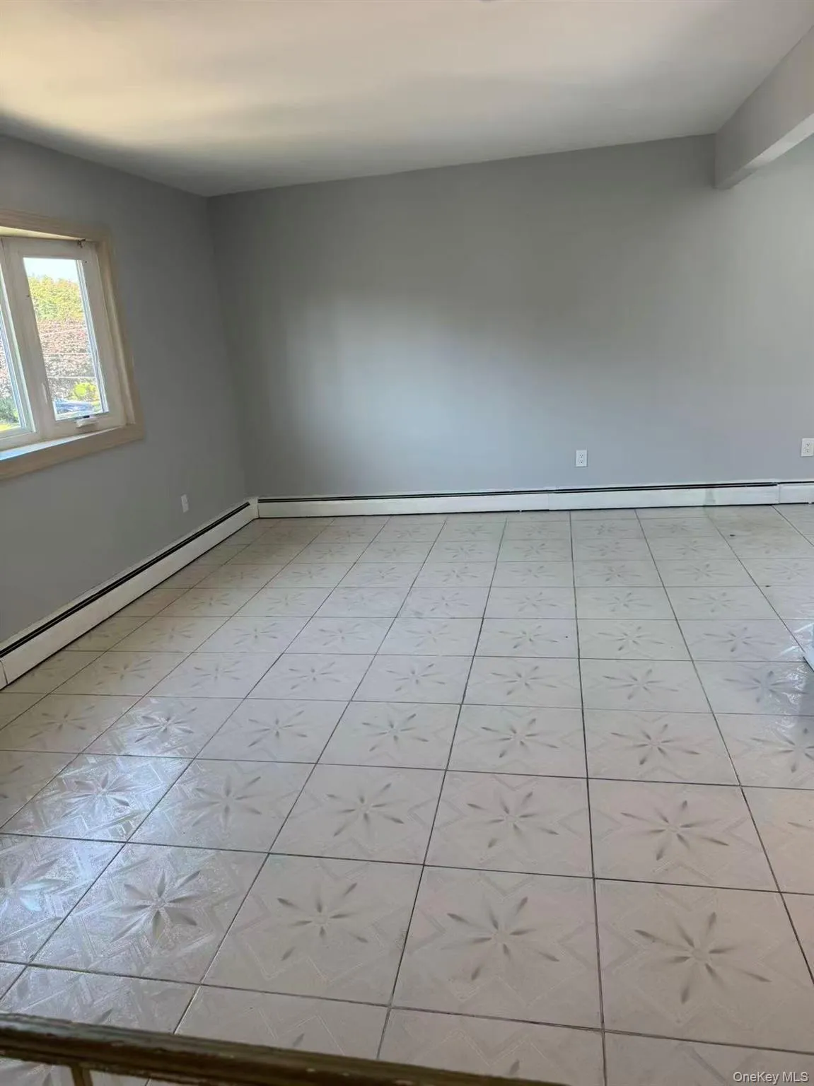 Spare room featuring a baseboard radiator Spare room featuring a baseboard radiator