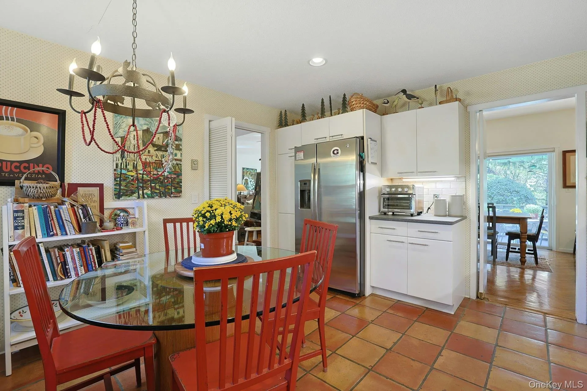 Kitchen Dining space featuring a chandelier, terracotta tile flooring, and recessed lighting Kitchen Dining space featuring a chandelier, terracotta tile flooring, and recessed lighting