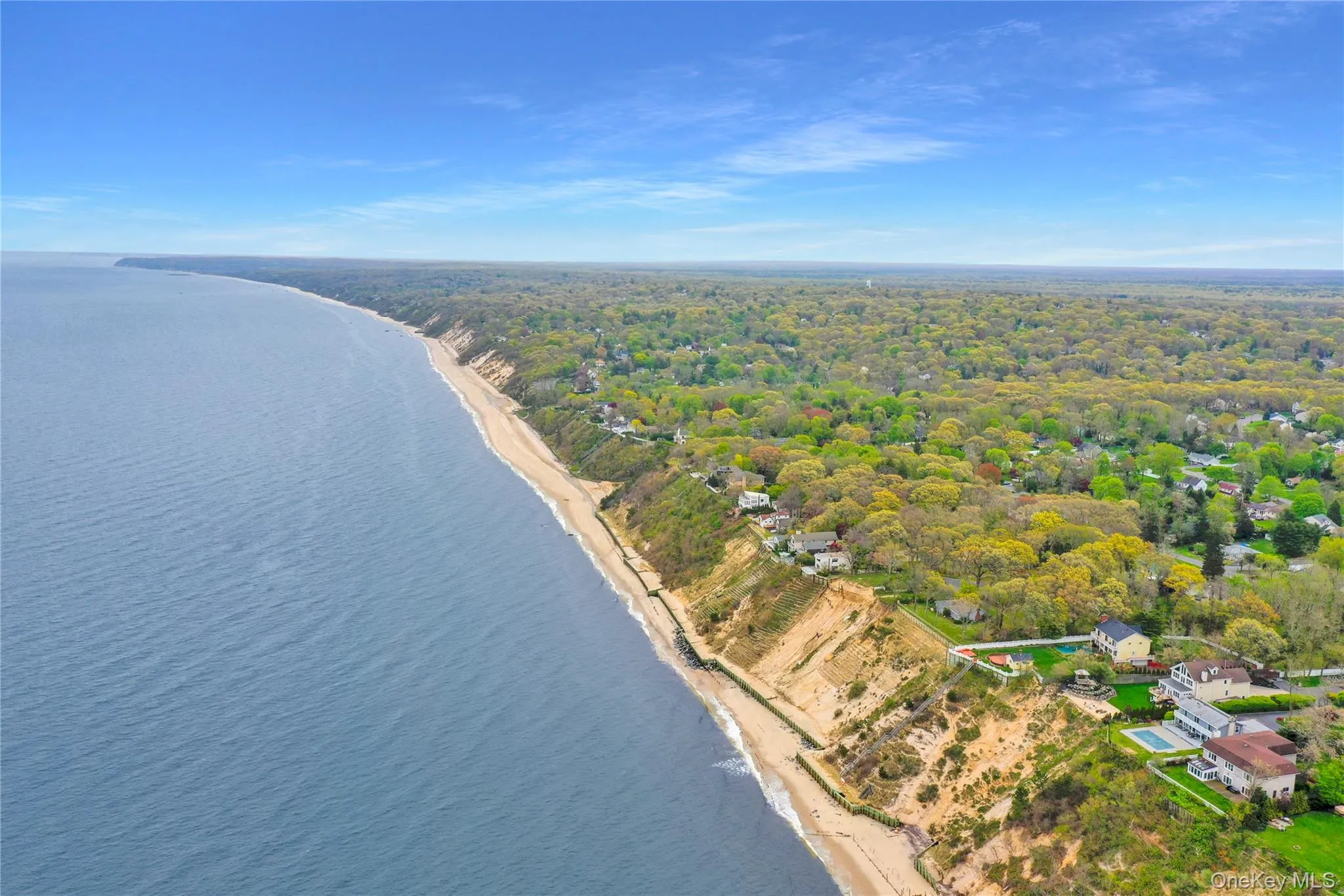 Drone / aerial view of unending shoreline and a heavily wooded area Drone / aerial view of unending shoreline and a heavily wooded area