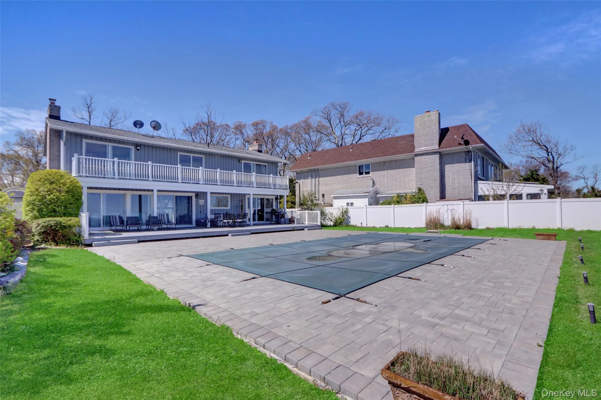 View of swimming pool featuring a patio and a balcony View of swimming pool featuring a patio and a balcony