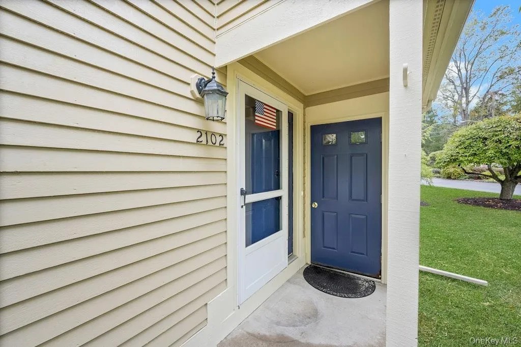 Entrance to property featuring a lawn Entrance to property featuring a lawn