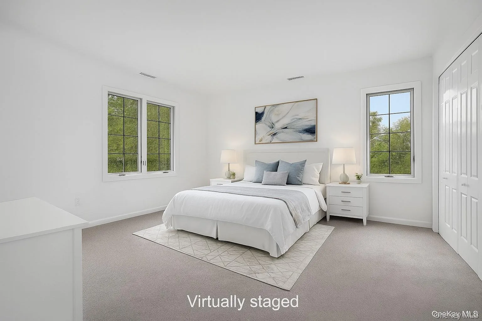 Bedroom featuring a closet and light colored carpet Bedroom featuring a closet and light colored carpet