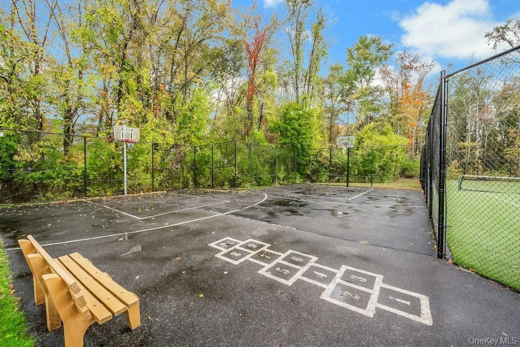 View of basketball court featuring community basketball court and view of scattered trees View of basketball court featuring community basketball court and view of scattered trees