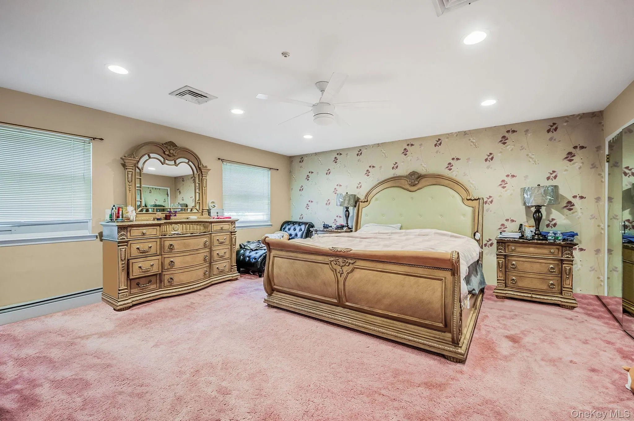 Bedroom with recessed lighting, wallpapered walls, a ceiling fan, and light colored carpet Bedroom with recessed lighting, wallpapered walls, a ceiling fan, and light colored carpet