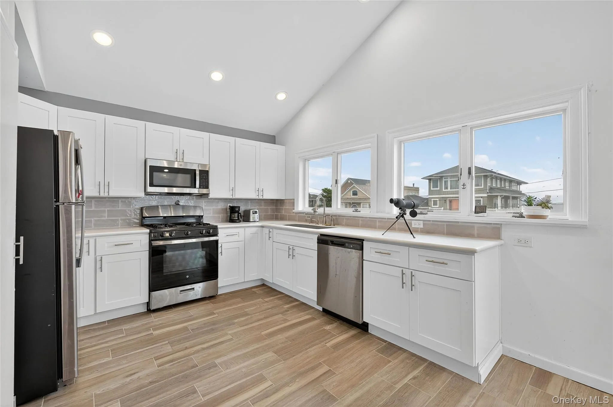 Newly updated kitchen with water view, stainless steel appliances and recessed lighting Newly updated kitchen with water view, stainless steel appliances and recessed lighting