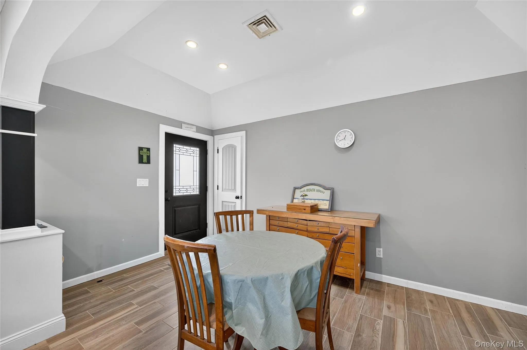 Dining room featuring wood-type floors and recessed lighting Dining room featuring wood-type floors and recessed lighting
