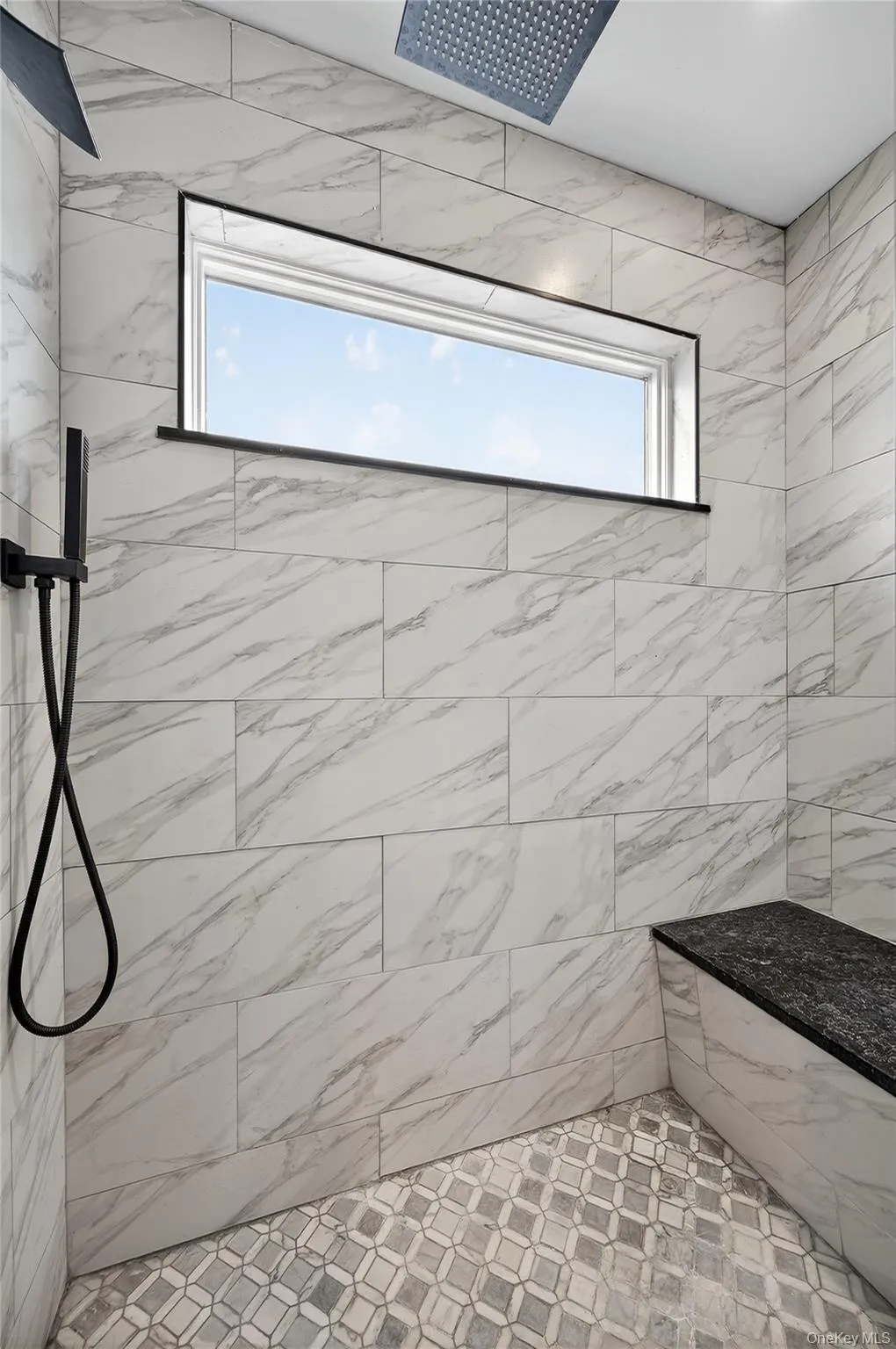 Bathroom featuring tile shower Bathroom featuring tile shower
