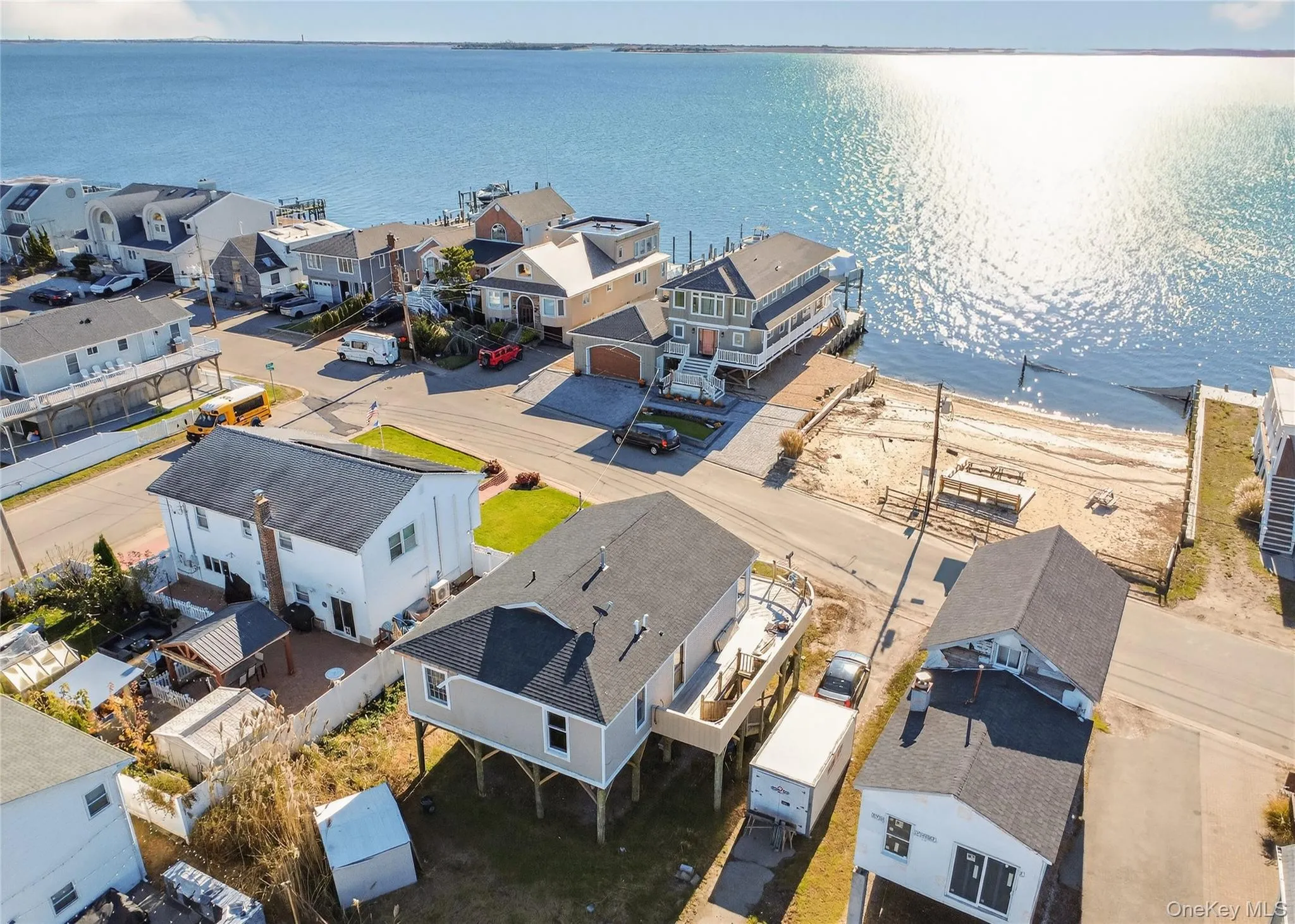 Aerial perspective of house with unobstructed water view Aerial perspective of house with unobstructed water view
