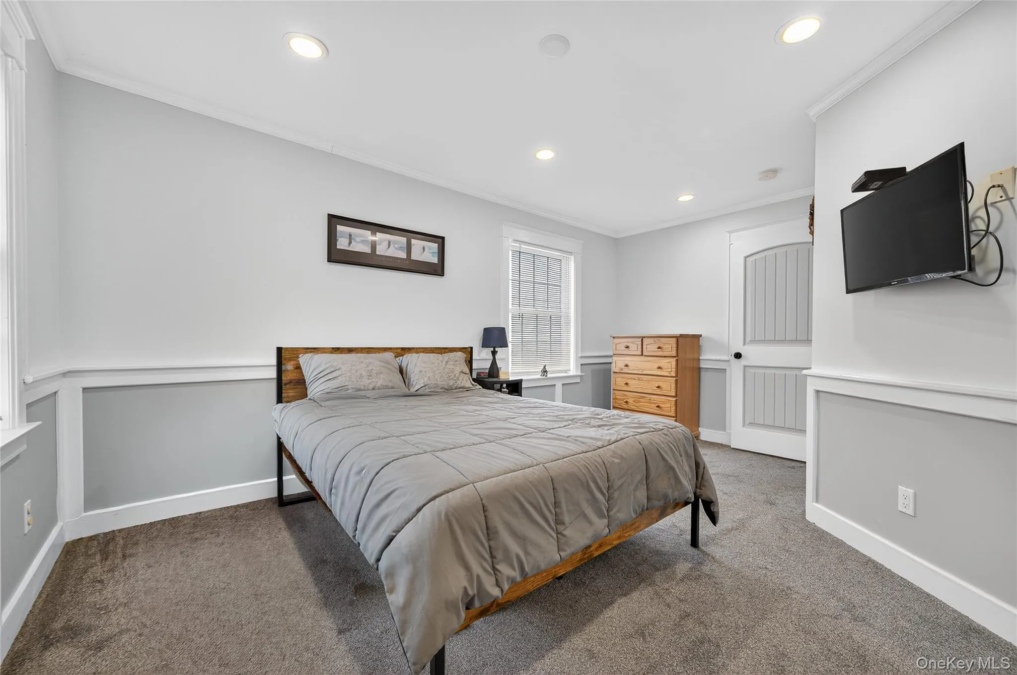 Primary Bedroom featuring ornamental molding, carpet flooring, and recessed lighting Primary Bedroom featuring ornamental molding, carpet flooring, and recessed lighting