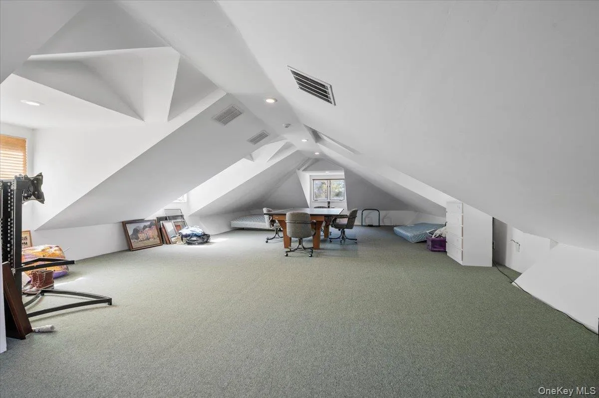 Additional living space featuring carpet flooring, lofted ceiling, and recessed lighting Additional living space featuring carpet flooring, lofted ceiling, and recessed lighting