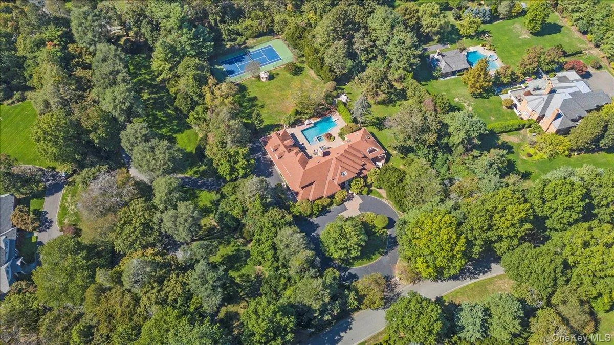 Aerial view of property and surrounding area with a pool Aerial view of property and surrounding area with a pool