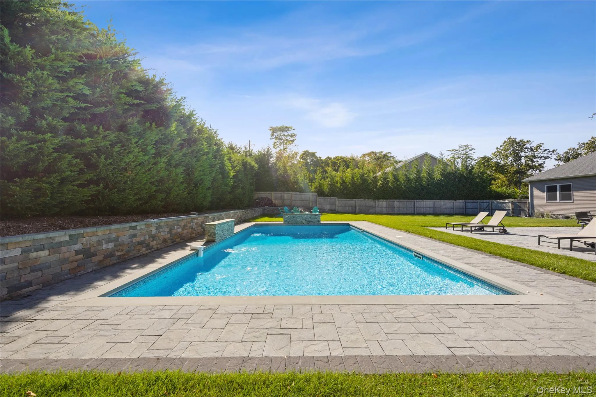 View of swimming pool with a patio and a fenced backyard View of swimming pool with a patio and a fenced backyard