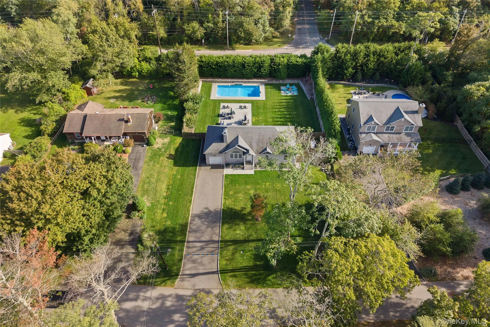 Aerial overview of property's location with a pool area Aerial overview of property's location with a pool area