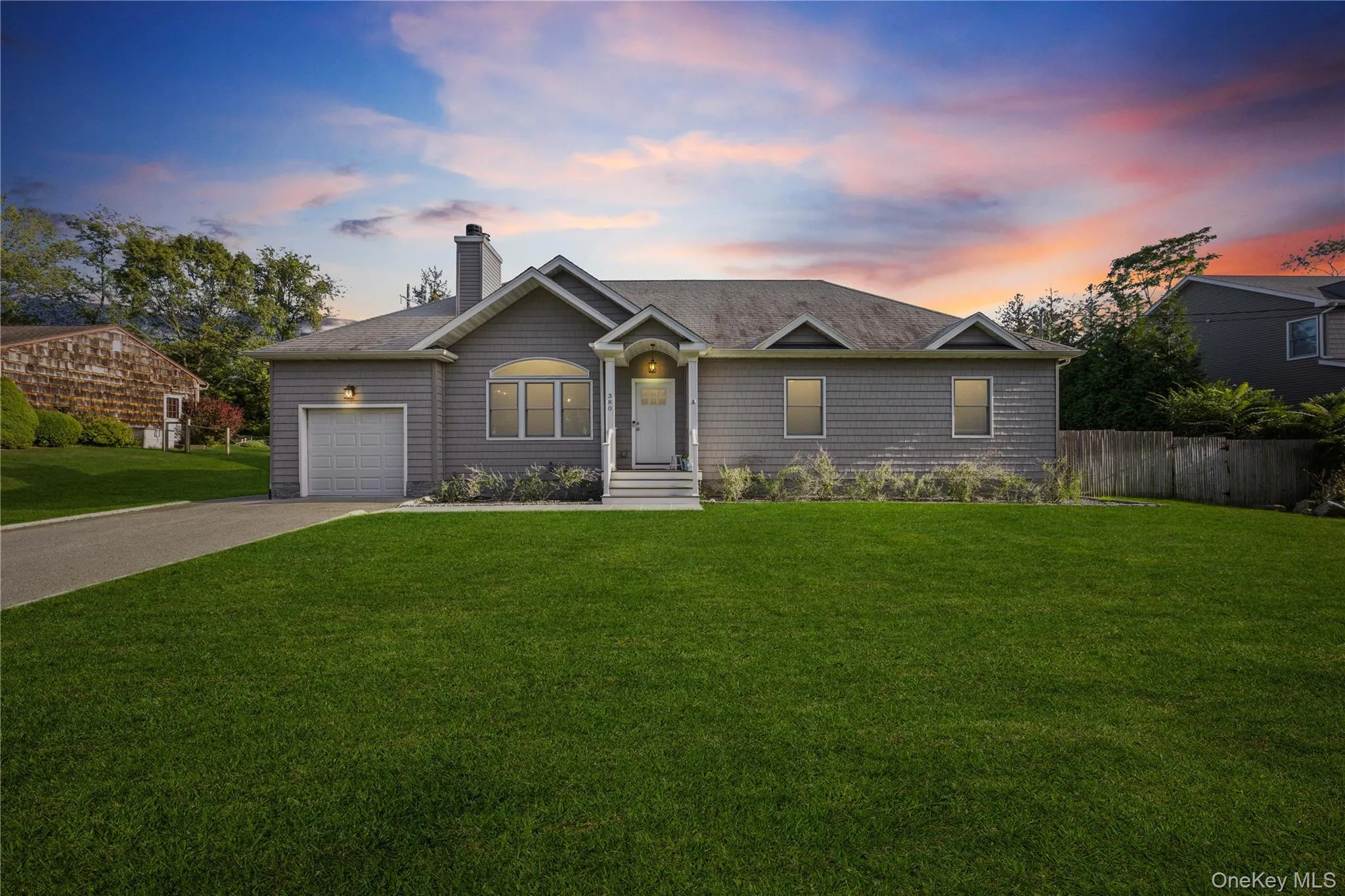 Ranch-style house featuring driveway, a chimney, a garage, and a shingled roof Ranch-style house featuring driveway, a chimney, a garage, and a shingled roof