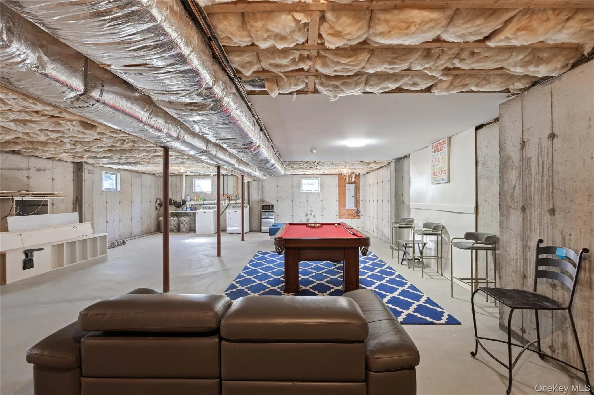 Playroom with concrete flooring and pool table Playroom with concrete flooring and pool table
