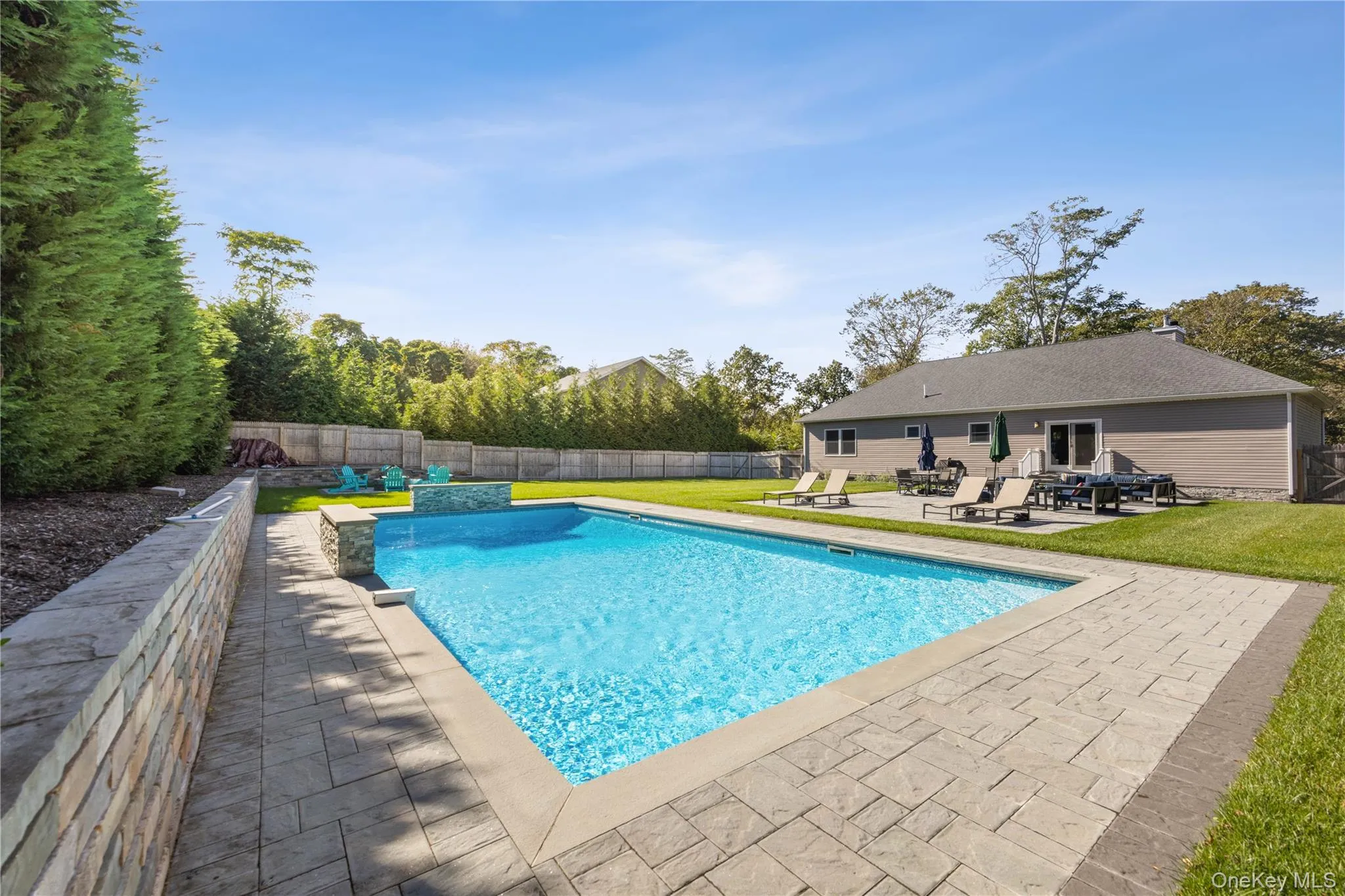 View of pool with a patio and a fenced backyard View of pool with a patio and a fenced backyard