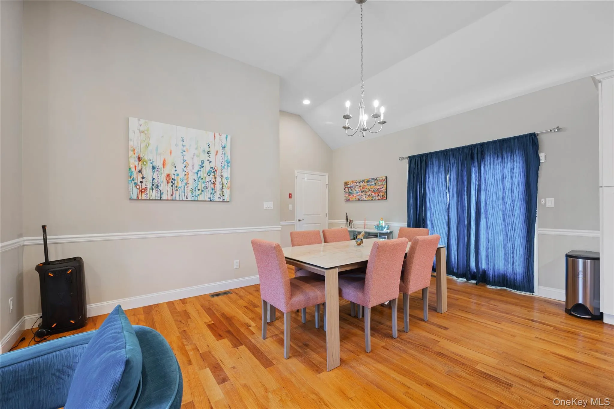 Dining area with light wood-style flooring, a chandelier, recessed lighting, and high vaulted ceiling Dining area with light wood-style flooring, a chandelier, recessed lighting, and high vaulted ceiling