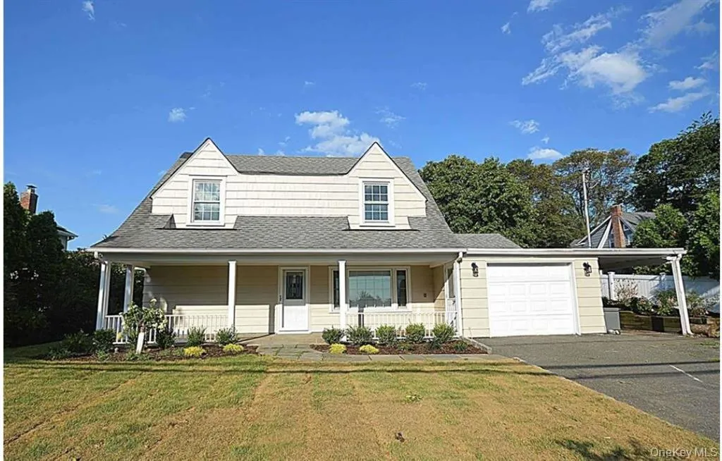 Cape cod house featuring a shingled roof, covered porch, driveway, a front lawn, and a garage Cape cod house featuring a shingled roof, covered porch, driveway, a front lawn, and a garage