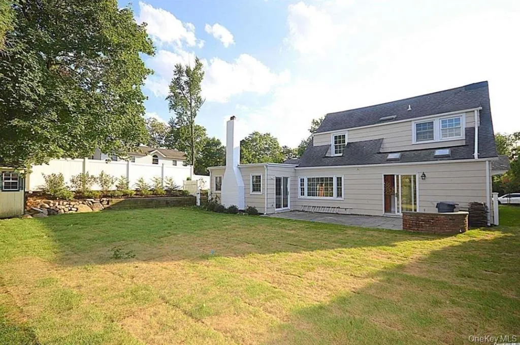 Rear view of property featuring a patio area Rear view of property featuring a patio area