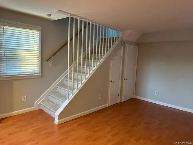 Stairs with wood finished floors and baseboards Stairs with wood finished floors and baseboards