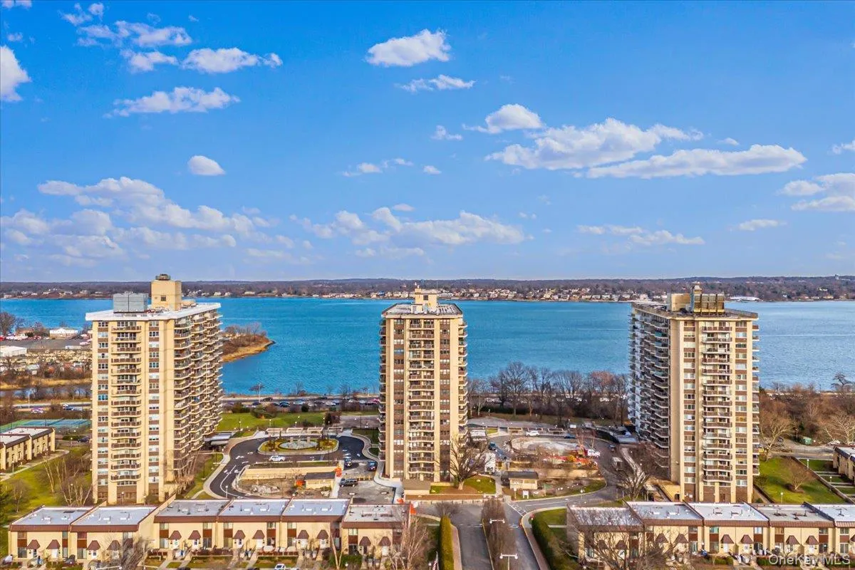 View of urban area with a nearby body of water and apartment complex / building View of urban area with a nearby body of water and apartment complex / building