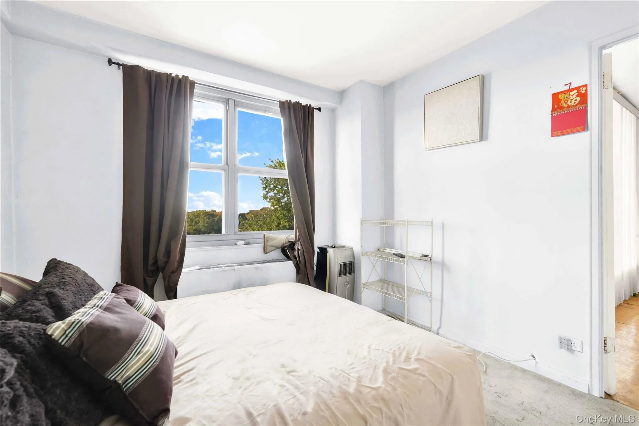 Bedroom with carpet flooring and baseboards Bedroom with carpet flooring and baseboards