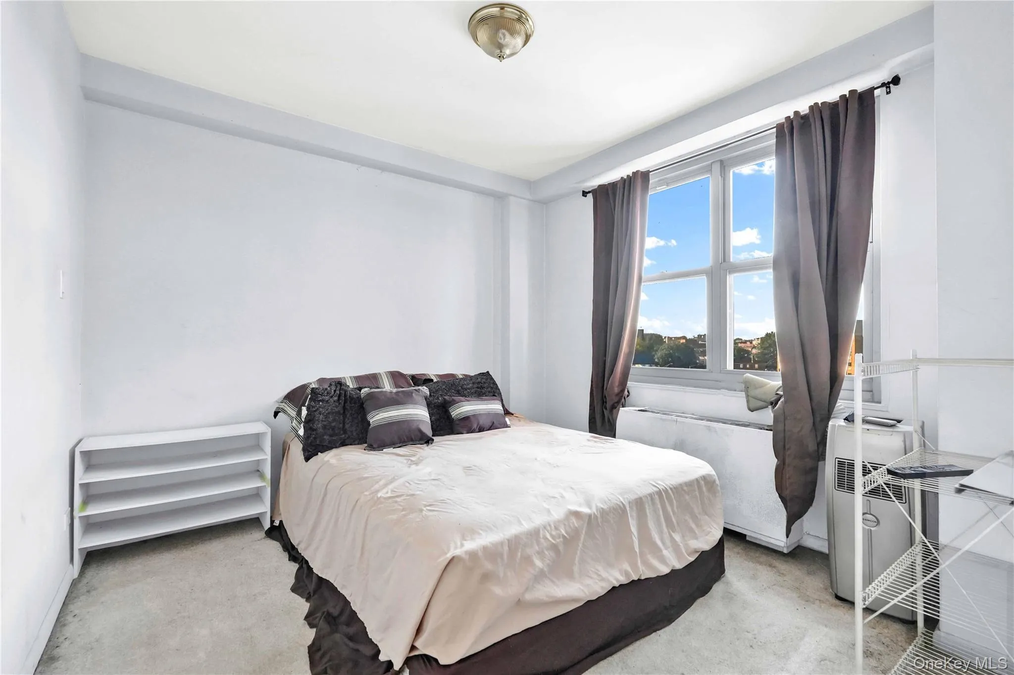 Bedroom featuring light colored carpet Bedroom featuring light colored carpet