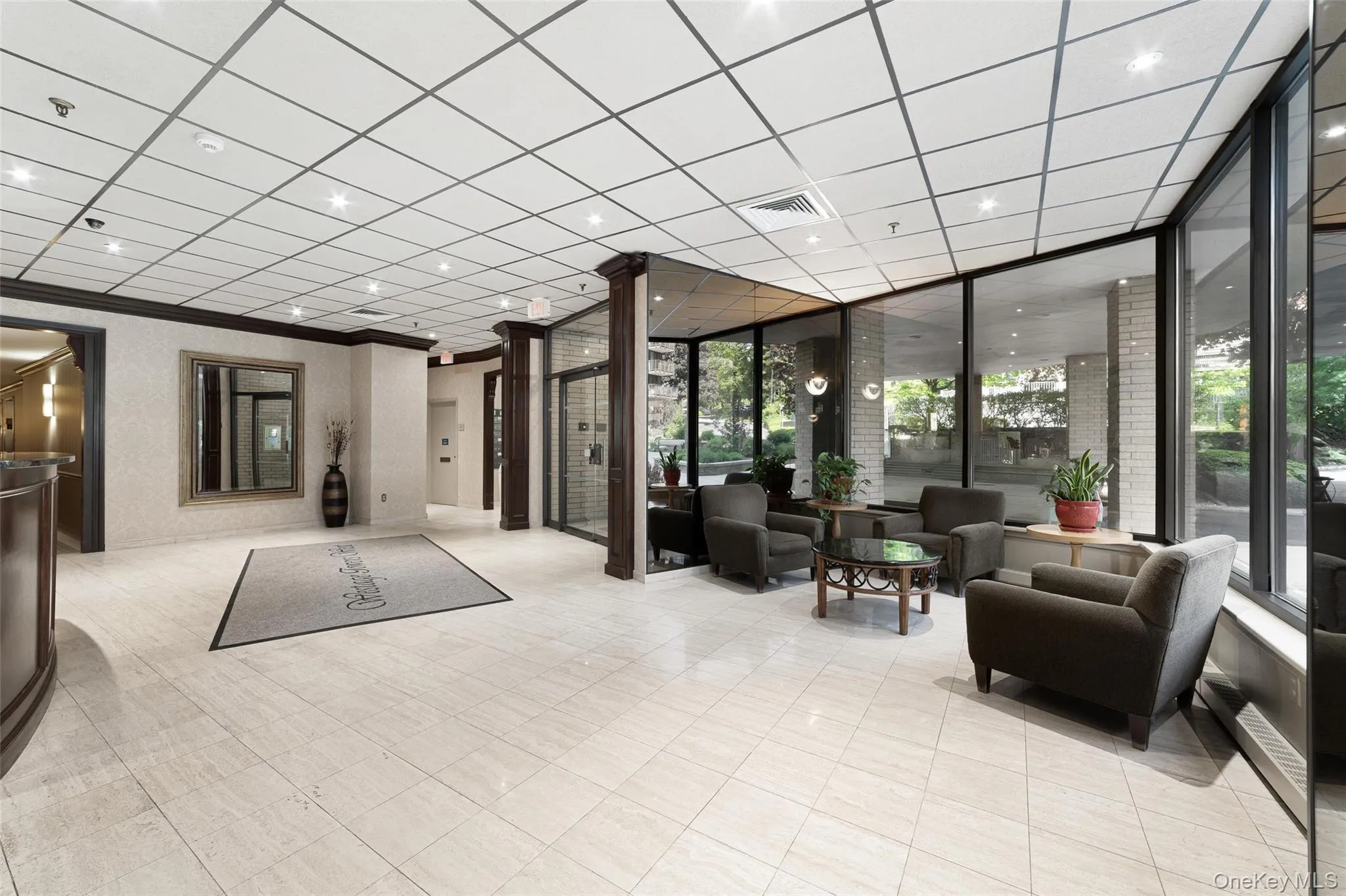 Lobby with recessed lighting, crown molding, and expansive windows Lobby with recessed lighting, crown molding, and expansive windows