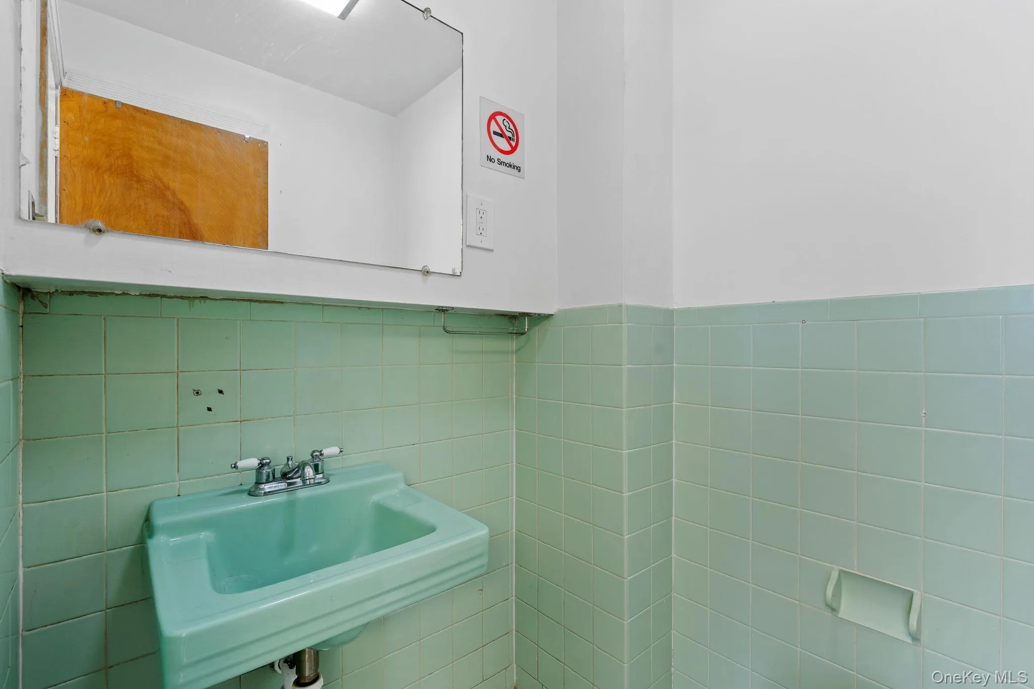 Bathroom with tile walls and wainscoting Bathroom with tile walls and wainscoting