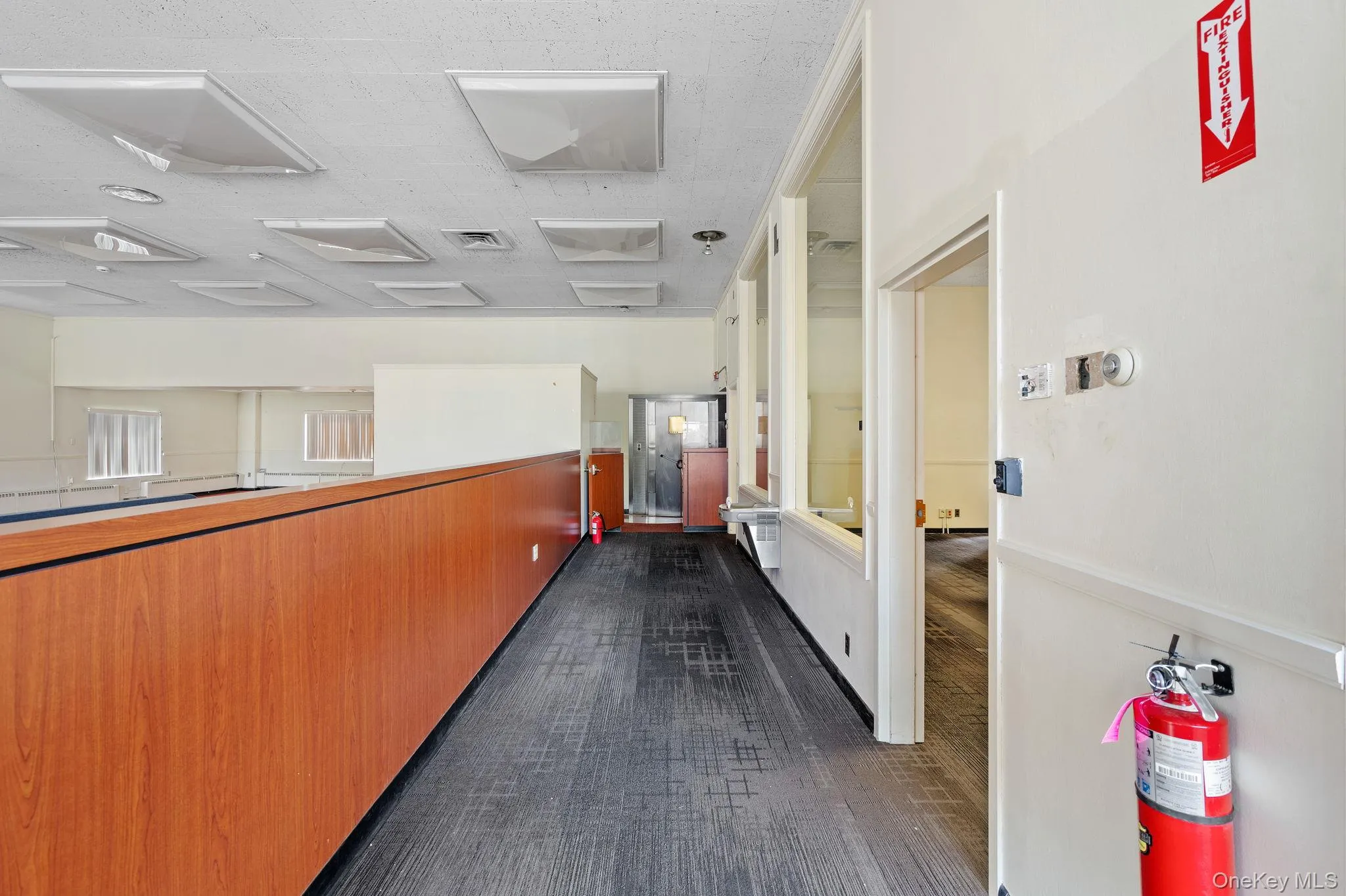 Hallway with dark carpet Hallway with dark carpet