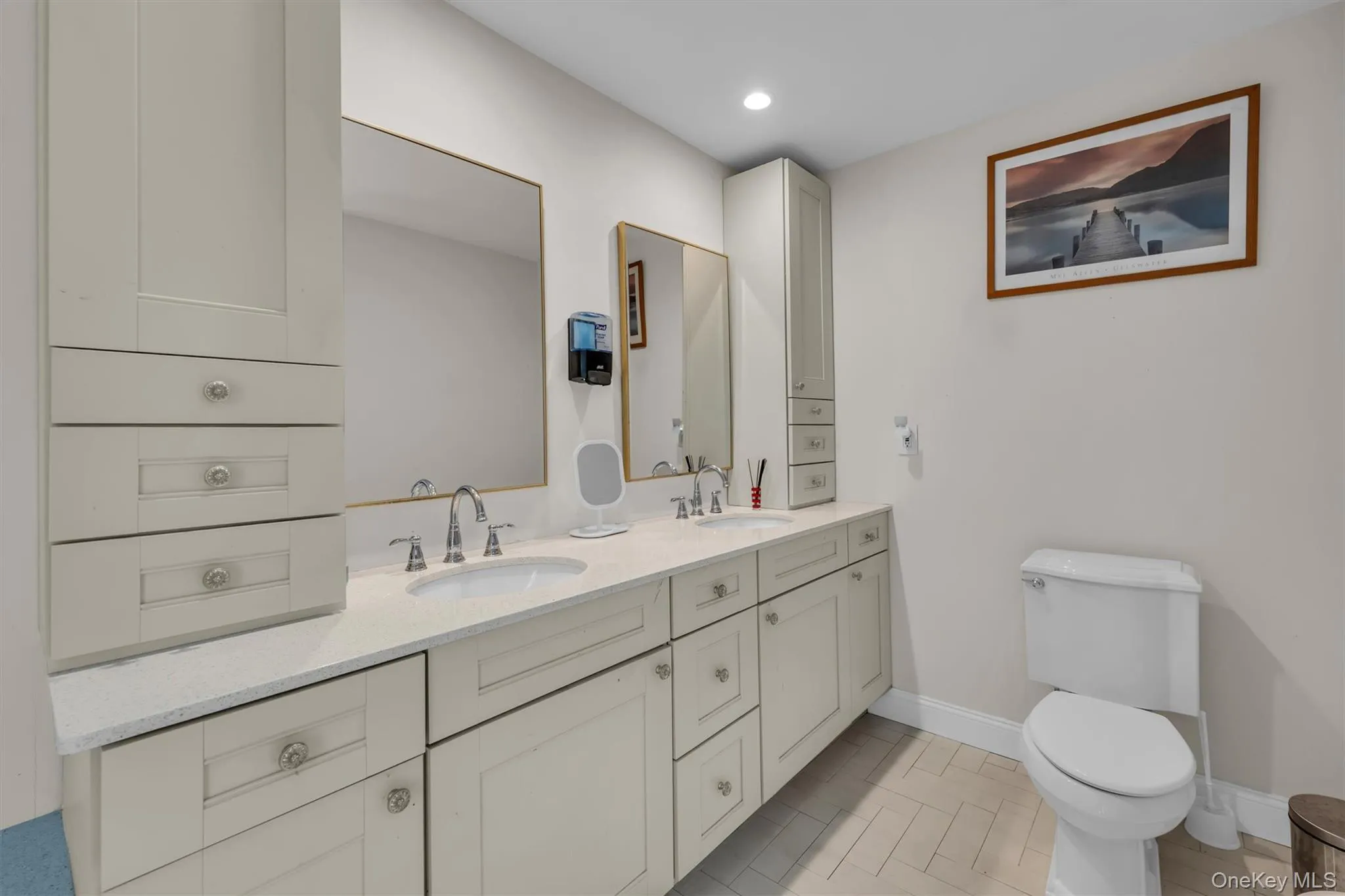 Full bathroom featuring double vanity, recessed lighting, and light tile patterned floors Full bathroom featuring double vanity, recessed lighting, and light tile patterned floors