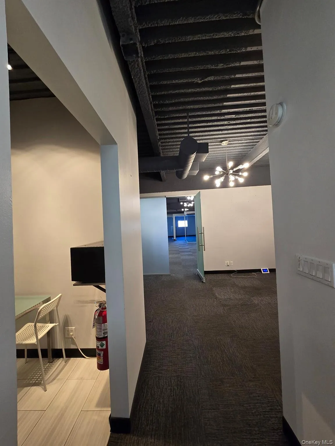 Corridor featuring dark carpet Corridor featuring dark carpet