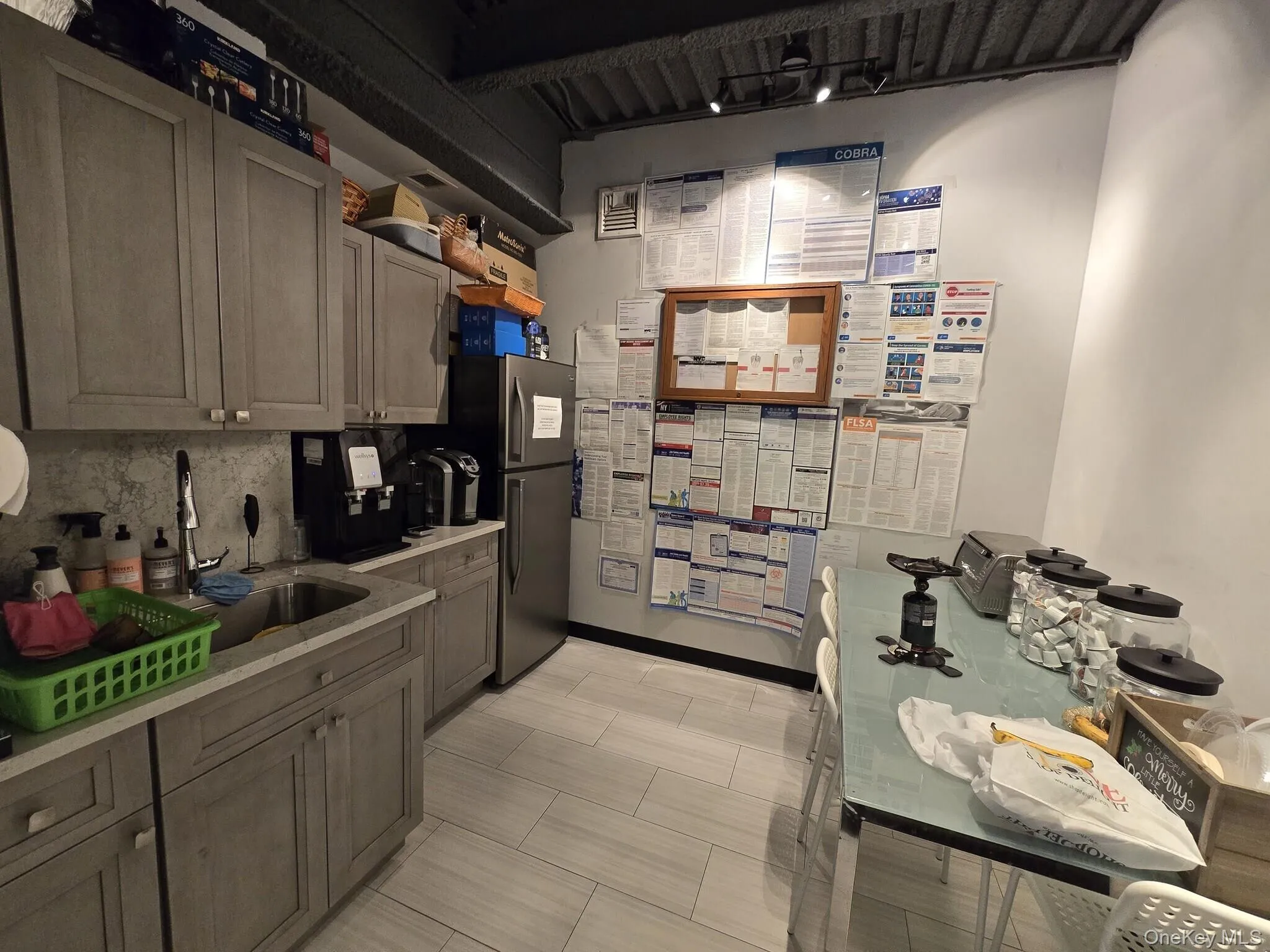 Kitchen with tasteful backsplash and light countertops Kitchen with tasteful backsplash and light countertops