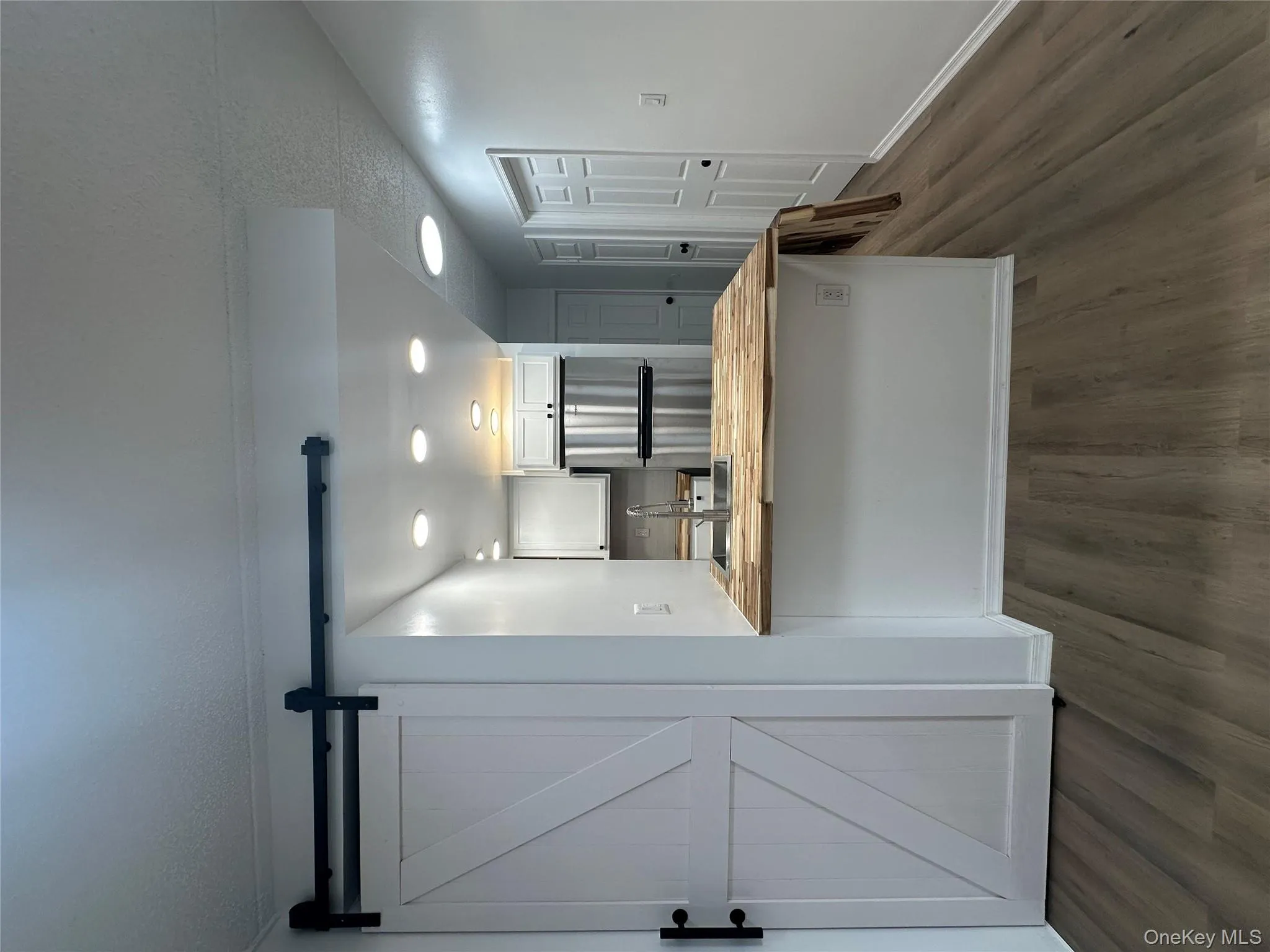 Kitchen with wood counters, dark wood-style flooring, a sink, and fridge Kitchen with wood counters, dark wood-style flooring, a sink, and fridge