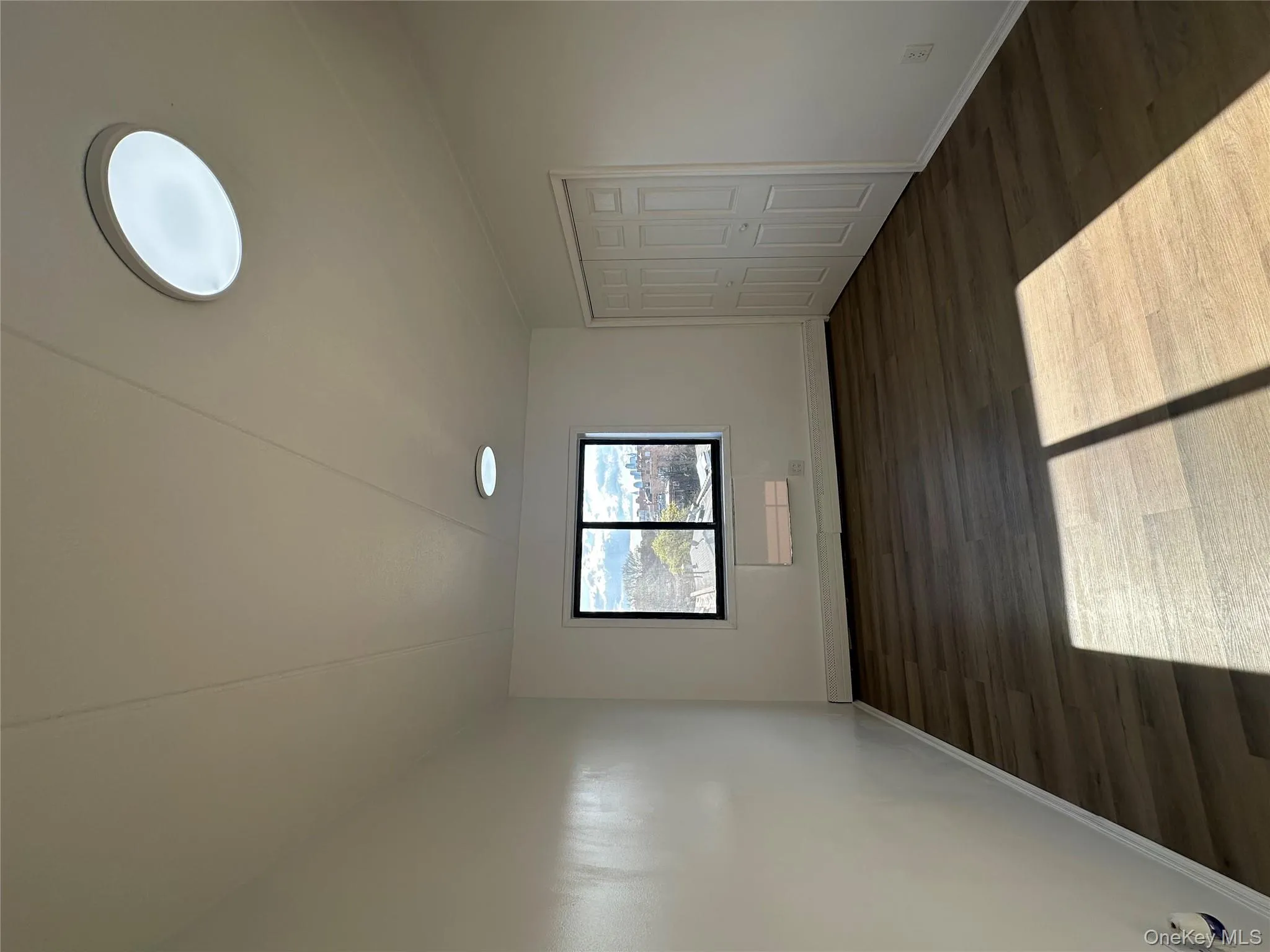 Primary room with baseboards and wood finished floors Primary room with baseboards and wood finished floors