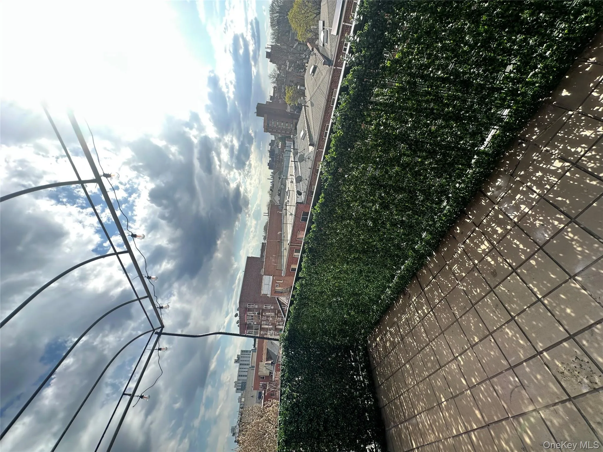 featuring a balcony and a view of city featuring a balcony and a view of city