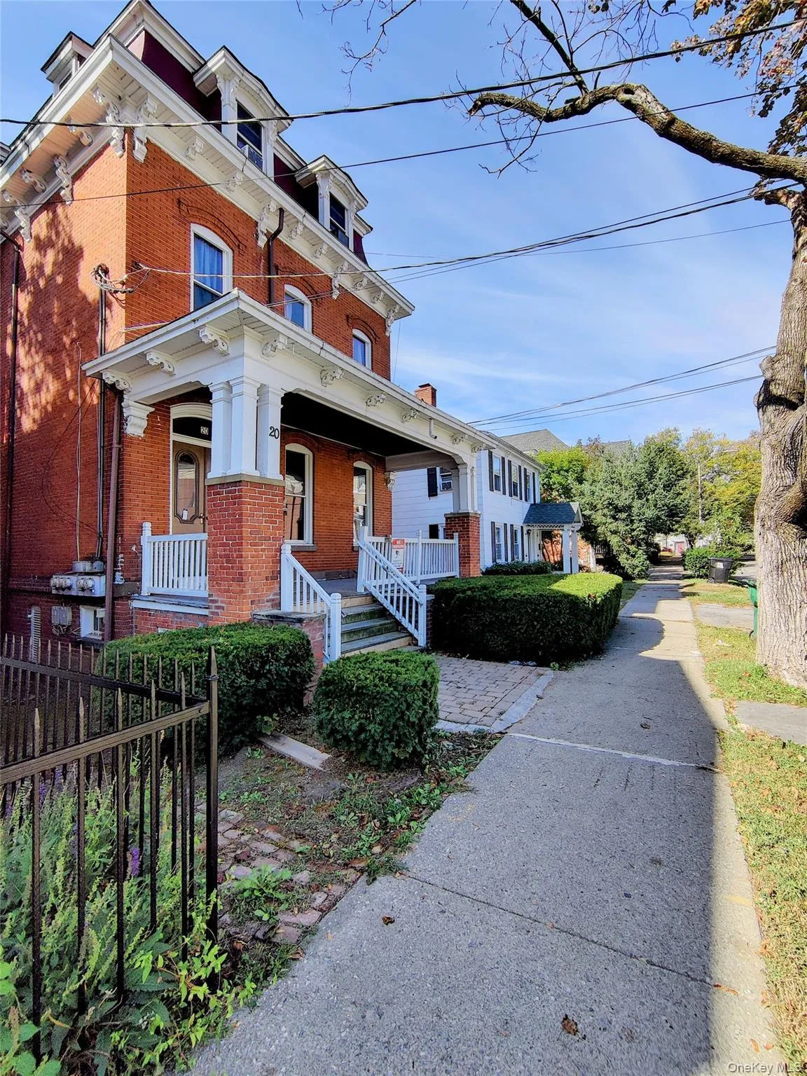 View of front of property with brick siding and covered porch View of front of property with brick siding and covered porch