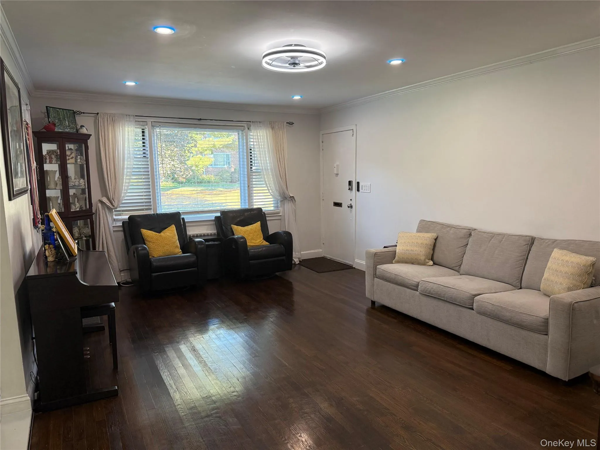 Living room with view of picture window looking out to courtyard Living room with view of picture window looking out to courtyard