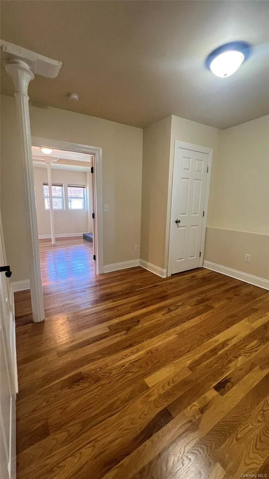 Bedroom featuring wood finished floors Bedroom featuring wood finished floors