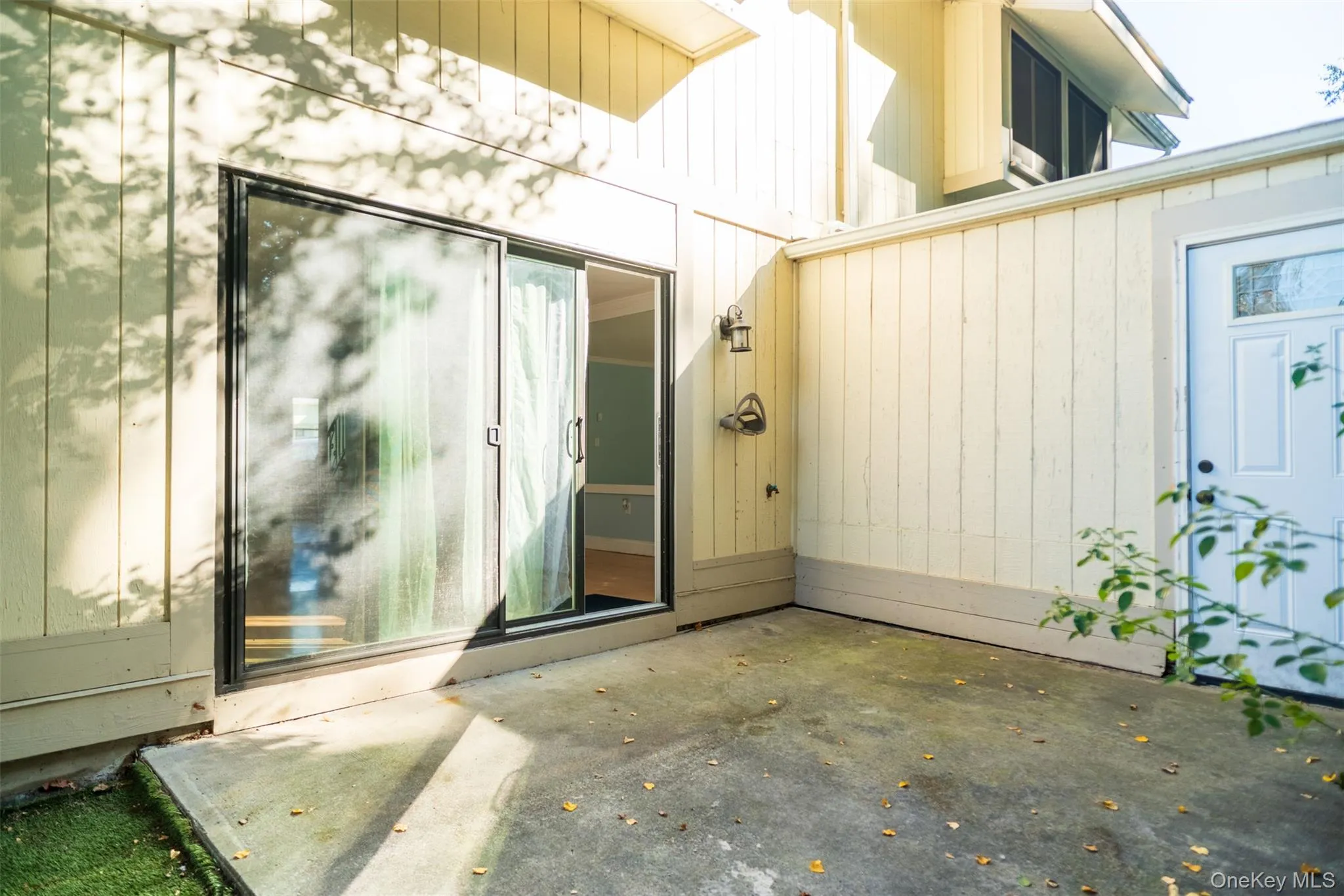 Property entrance featuring a patio Property entrance featuring a patio