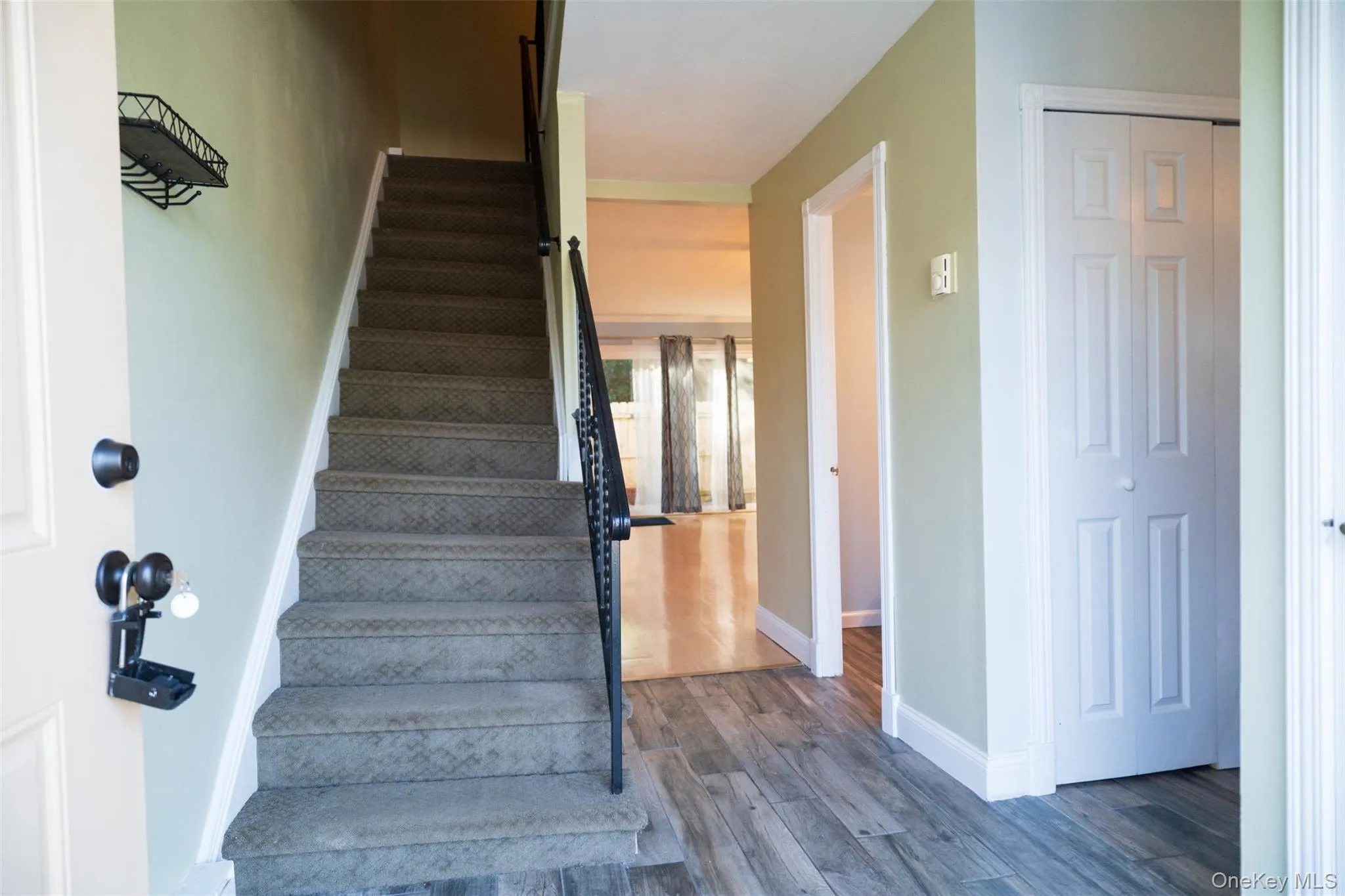 Stairs featuring baseboards and wood finished floors Stairs featuring baseboards and wood finished floors